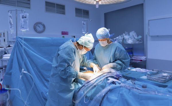 Surgeons performing surgery in operating Theater.